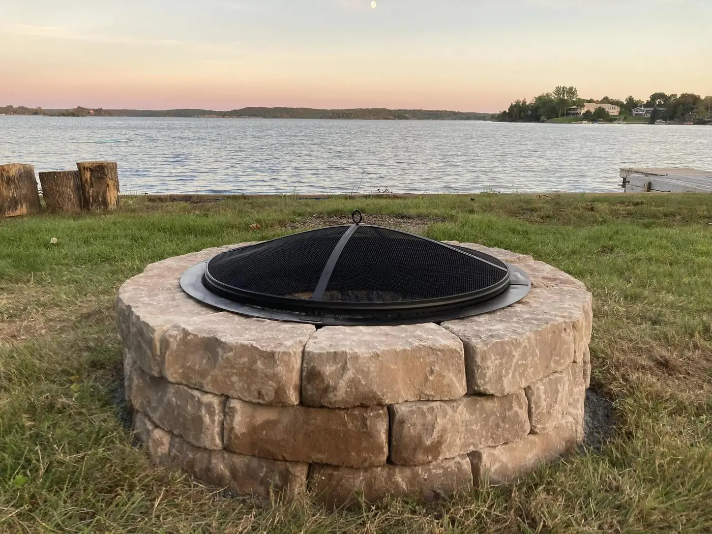 Stone firepit beside a Northern Ontario lake