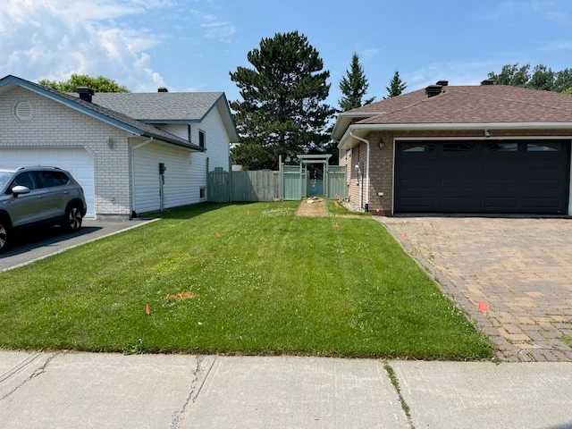 Front lawn between neighbouring homes and driveways — before, pair 32 of 36